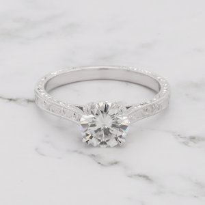 Round Moissanite ring in hand carved setting
