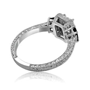 Vintage Art Deco 3-stone emerald cut lab diamond ring with trapezoid sapphire side stones, pavé diamonds, and milgrain edges.