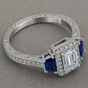 art deco emerald cut lab diamond sapphire ring trapezoid side stones halo hand engraved milgrain pavé orospot