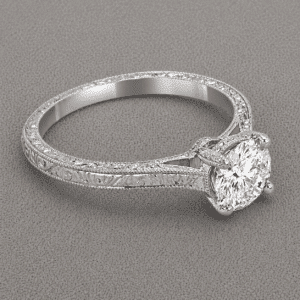 Vintage engraved diamond engagement ring with 1.5ct round center stone in four prong setting and milgrain band by OroSpot