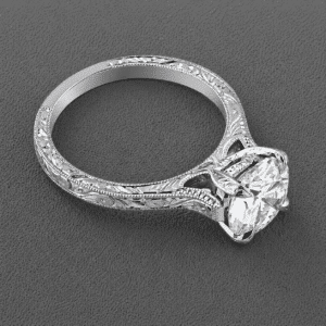 antique style solitaire engagement ring setting with scroll engraving and polished finish