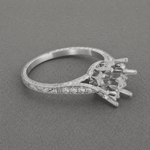 decorative six prong semi mount with engraved vintage shank and accent diamonds on grey background