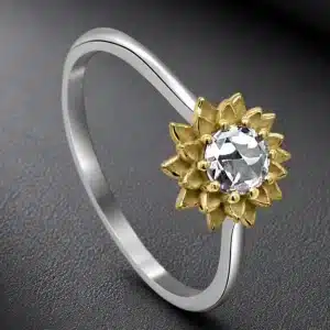 petite sunflower engagement ring with a rose cut diamond, sandblasted gold petals, and platinum shank