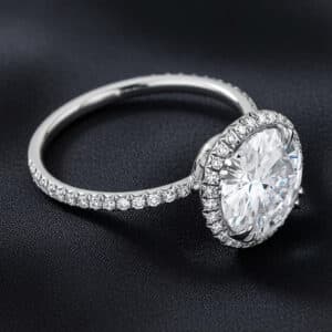 14K white gold halo engagement ring with a round lab-grown diamond and micro pavé diamond band.