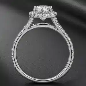 Elegant halo engagement ring with an elongated cushion lab-grown diamond, pavé split shank, and flush-fit design for easy pairing with wedding bands.