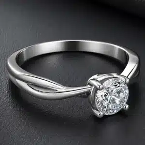 Modern infinity solitaire engagement ring with round certified lab-grown diamond and sleek polished band.
