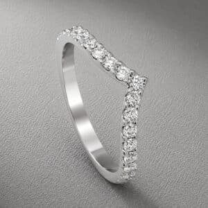 V shaped pavé diamond curved band in 14K yellow gold featuring natural round diamonds in a chevron ring enhancer design.