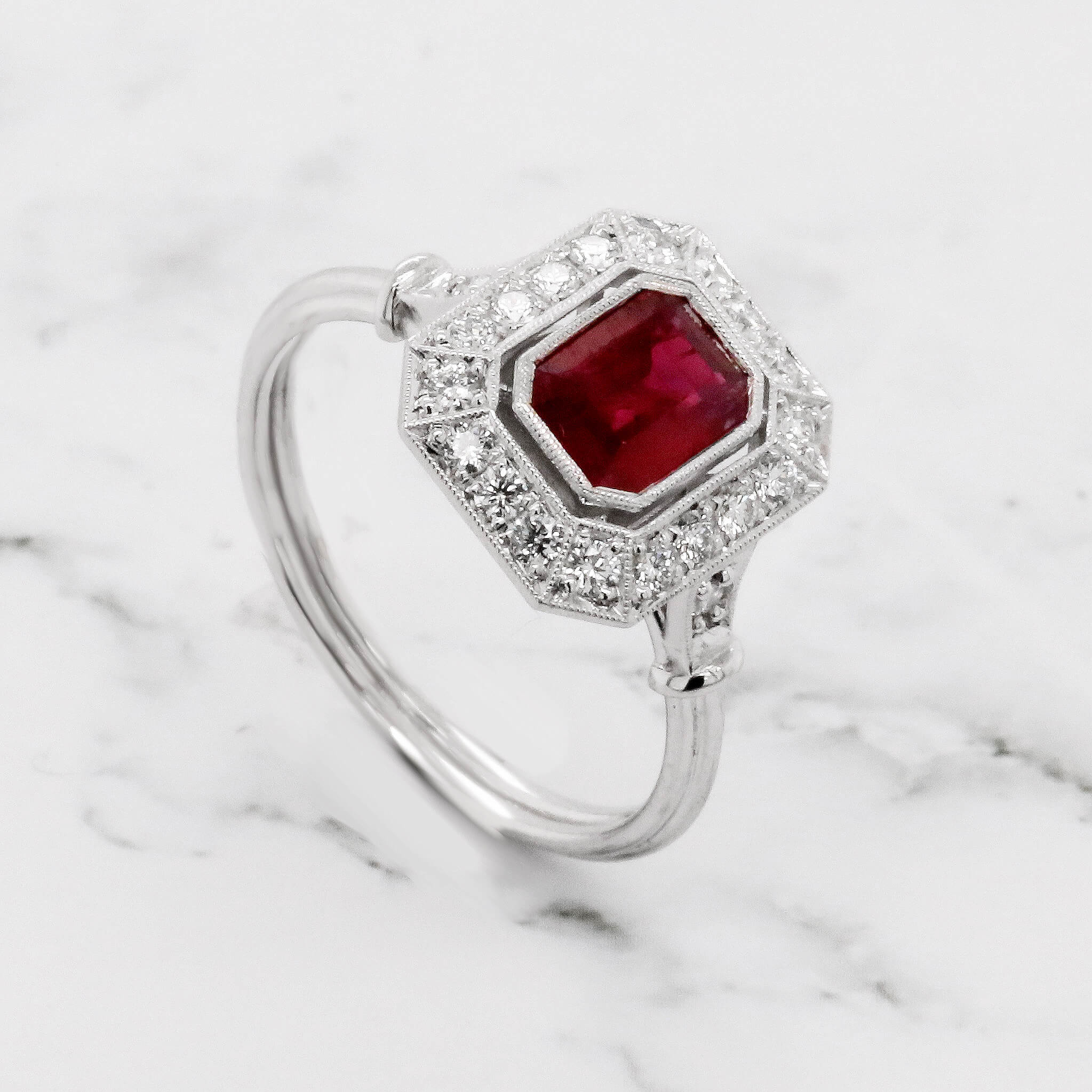 Emerald cut ruby engagement ring