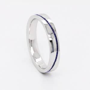 Modern sapphire channel wedding band'