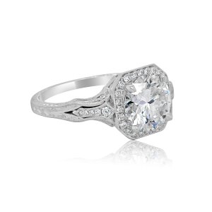 Radiant halo engraved ring