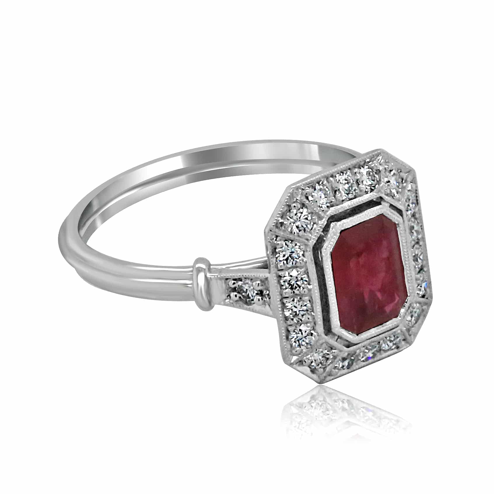 Side profile of Art Deco emerald cut ruby and diamond engagement ring with filigree under-gallery.