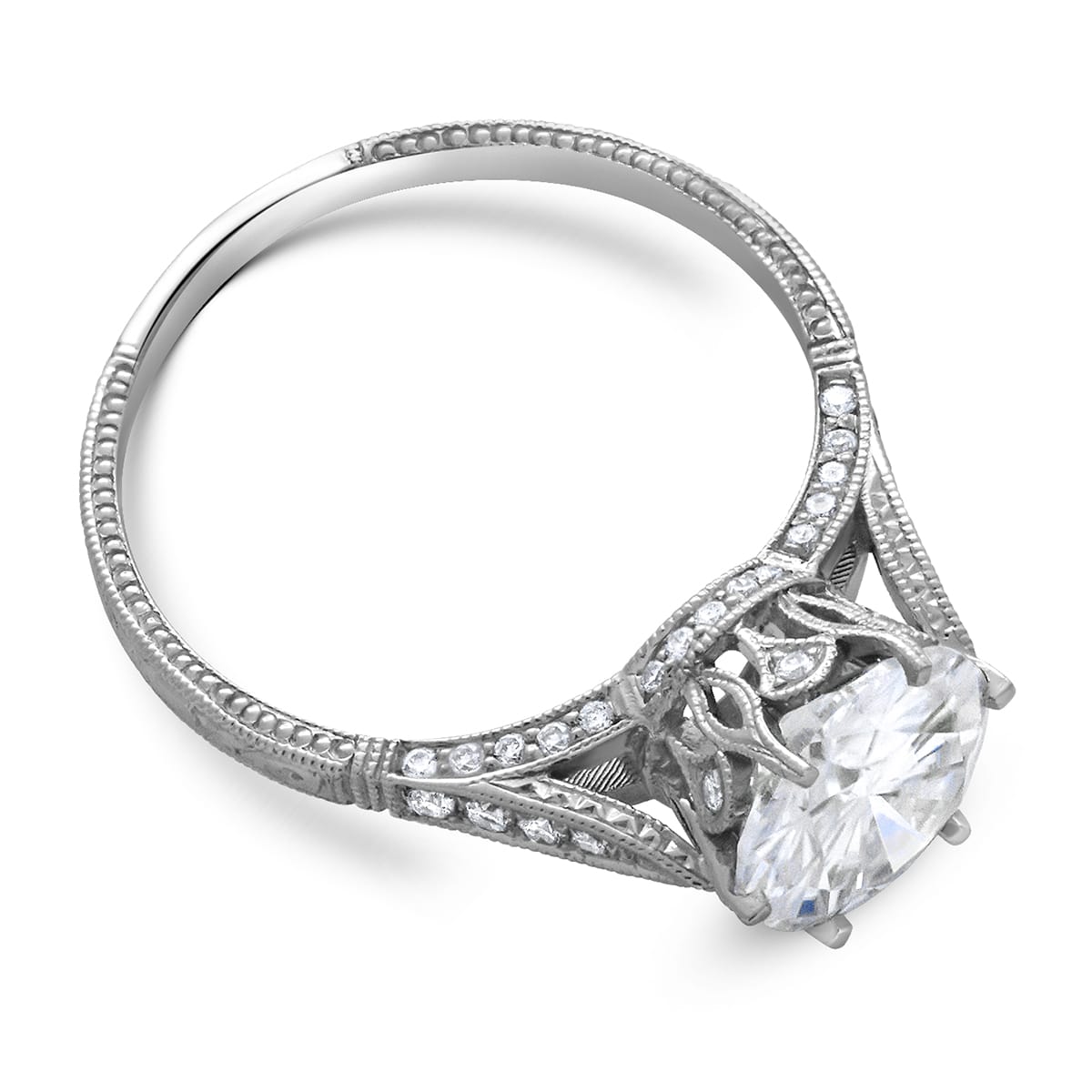Antique crown diamond engagement ring with intricate hand engraving, milgrain detailing, and a sparkling center diamond in a vintage setting