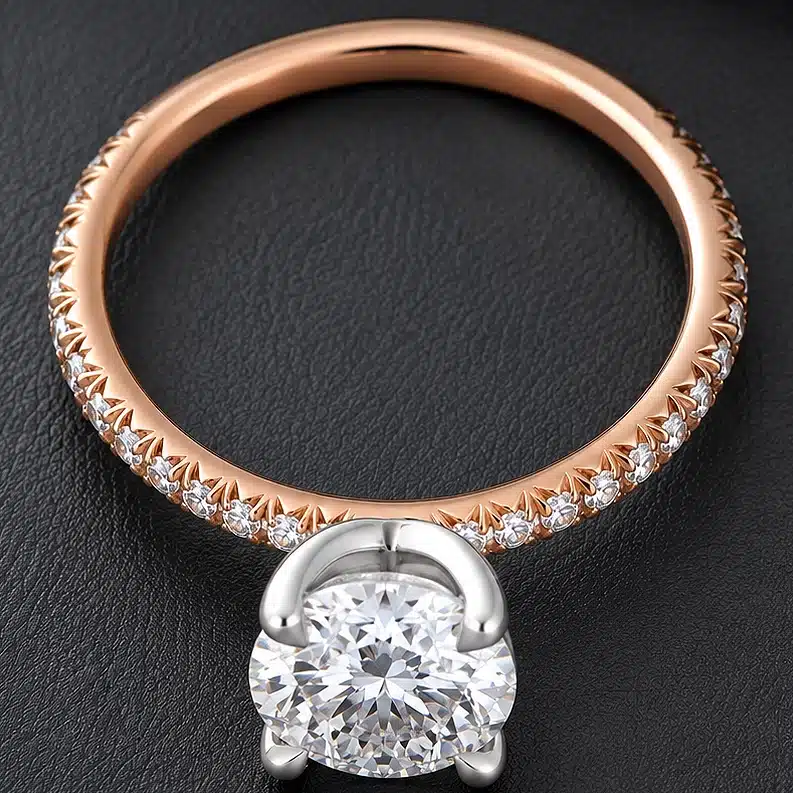 Modern dainty engagement ring featuring a certified 1.5ct round lab-grown diamond, platinum basket, 14K rose gold shank, and pavé natural diamonds.