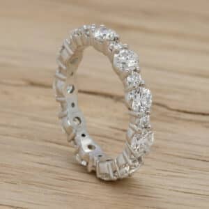 Alternating diamond eternity band with round and rectangular stones set in vintage-inspired milgrain bezels OroSpot