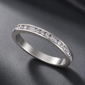 Alternating baguette and round diamonds create a refined wedding band with modern elegance and timeless sparkle.