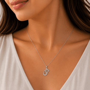 Diamond AUM pendant in solid gold with polished spiritual design by OroSpot.