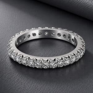 Modern eternity wedding band featuring 1 carat of diamonds set all the way around the ring in a cut-down setting.