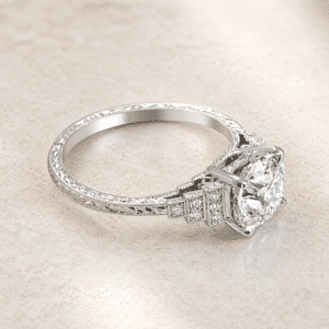 side view of art deco step diamond engagement ring with 2 carat lab diamond, pave shoulders and engraved band in white gold orospot