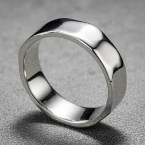 asymmetrical mens wedding ring flowing surface rounded edges polished finish comfort fit band orospot