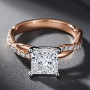 Princess cut lab-grown diamond engagement ring with a braided diamond-accented band and white gold prong setting.