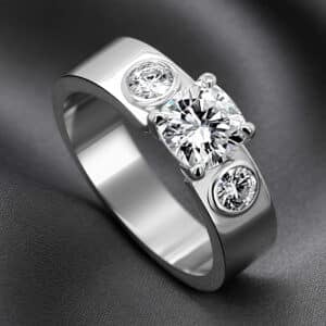 Modern white gold engagement ring with cushion lab diamond and bezel-set round side diamonds handcrafted by OroSpot.