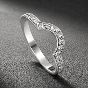 Modern diamond curved band in 14K gold featuring pavé-set diamonds and a sleek contour design for a round engagement ring.