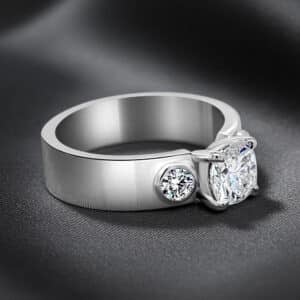 14K white gold engagement ring with cushion-cut lab-grown diamond center and modern bezel-set accents by OroSpot.
