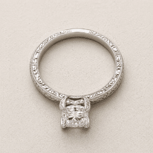 antique solitaire diamond engagement ring with hand engraved band, milgrain detail and vintage inspired design