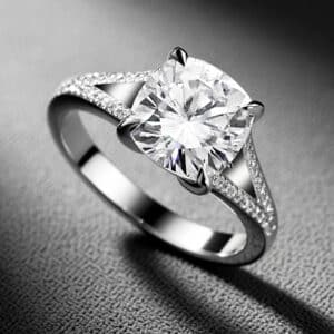 Modern cushion-cut diamond ring with split shank white gold band and certified 3ct center stone by OroSpot.