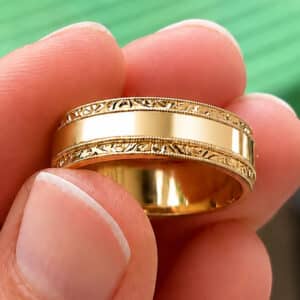 Vintage-inspired Art Deco men’s wedding band with hand-engraved side stripes, milgrain edges, and polished center made in 18K gold or platinum.