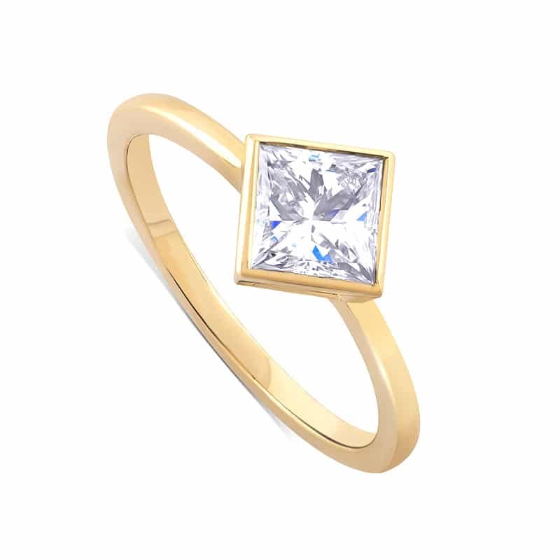 Modern bezel diamond solitaire kite set ring by OroSpot