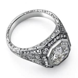 Vintage hand-engraved Asscher cut halo diamond engagement ring in 14K white gold with intricate filigree detailing and milgrain edges