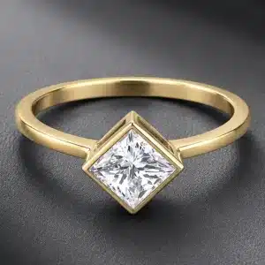 Kite set princess cut lab diamond engagement ring in solid 14K yellow gold with bezel setting and high polish finish.
