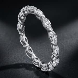 Elegant eternity wedding band featuring marquise-cut lab-grown diamonds encircling the entire ring in a minimalist shared-prong setting.