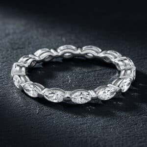 Delicate eternity band featuring lab-grown marquise diamonds set in shared prongs, creating a continuous floating diamond design.