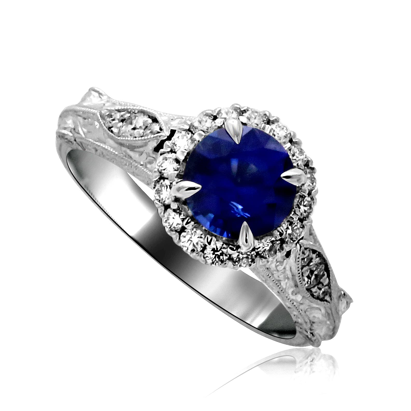 Vintage Art Deco sapphire engagement ring in 14K gold with 1.5ct blue sapphire and brilliant accent diamonds.