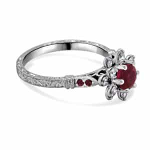 Art Nouveau ruby flower ring with natural ruby, diamond accents, and handcrafted floral halo