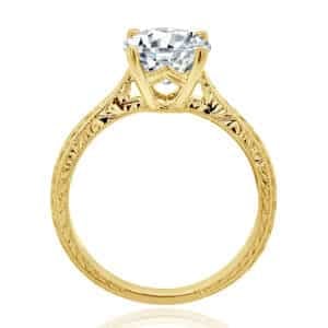 Side view of vintage engagement ring showing hand-engraved scroll and wheat design in 18K gold