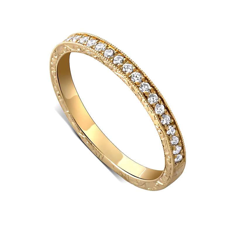 Vintage-inspired diamond band with pavé-set stones and small sizing bar, hand-engraved with milgrain edges in 14K gold by OroSpot.