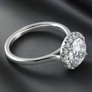 Certified round diamond halo ring with a brilliant center stone and sparkling natural diamond halo.
