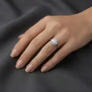 Classic round halo ring featuring a lab-grown center diamond and natural G-VS quality accent diamonds.