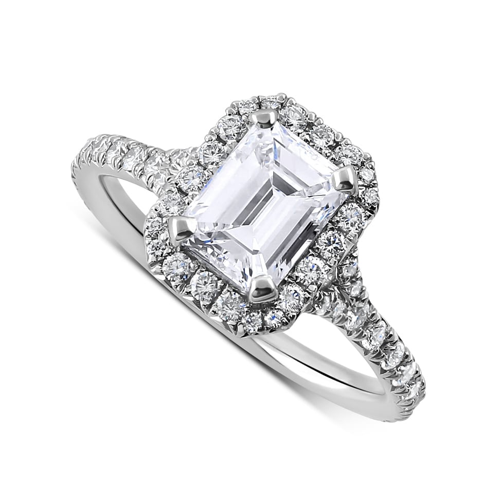 Contemporary emerald cut diamond halo ring in 14K white gold with natural diamonds, sleek modern design, elegant and stylish engagement ring.