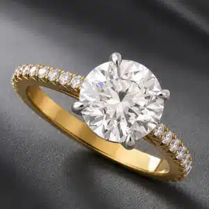 Elegant 3ct lab-grown diamond engagement ring with natural diamond accents in a two-tone platinum and yellow gold setting.