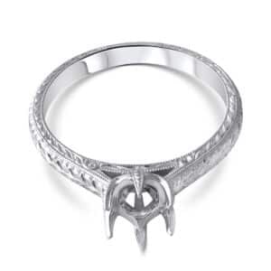 Hand-carved vintage engagement ring mounting with intricate scrollwork and antique-style detailing.