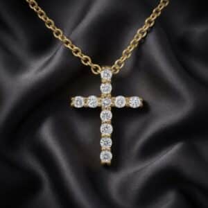 Mini diamond cross pendant in 14K white gold with round brilliant diamonds and delicate everyday design handcrafted by OroSpot.