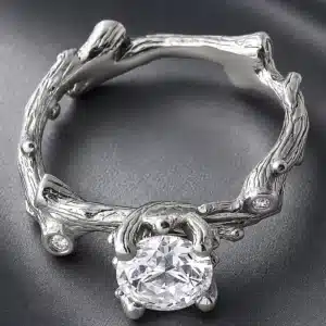 Nature inspired twig engagement ring in 14K white gold featuring a 1.25ct round lab-grown diamond and textured bark finish.