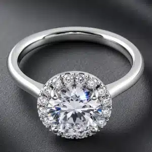Elegant round diamond halo engagement ring featuring a 2ct certified lab-grown diamond surrounded by natural accent diamonds in platinum.
