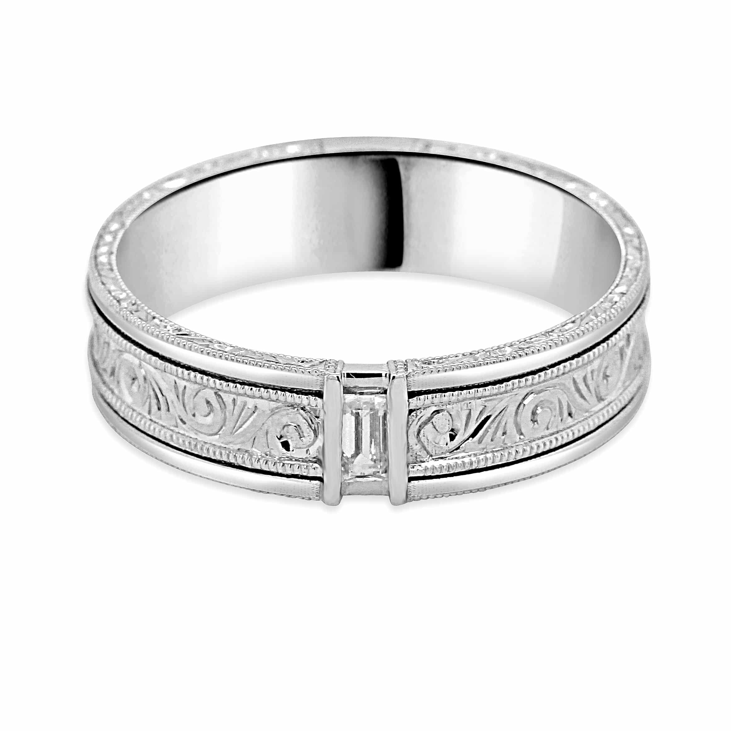 Art Deco men’s wedding ring featuring a baguette diamond with hand engraving and milgrain edges in platinum.