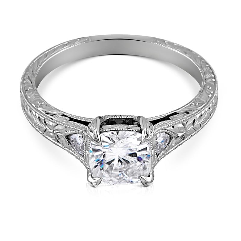 Vintage cushion cut diamond ring with trillion side stones and hand engraving by OroSpot.