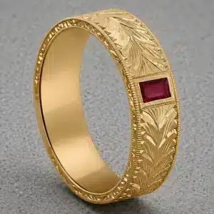 antique men’s wedding band with flush set baguette ruby and hand engraved gold band